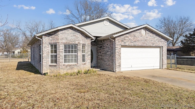 ranch-style home with a garage and a front yard