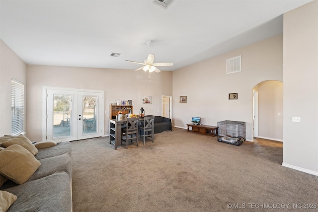 living room with carpet, ceiling fan, and french doors