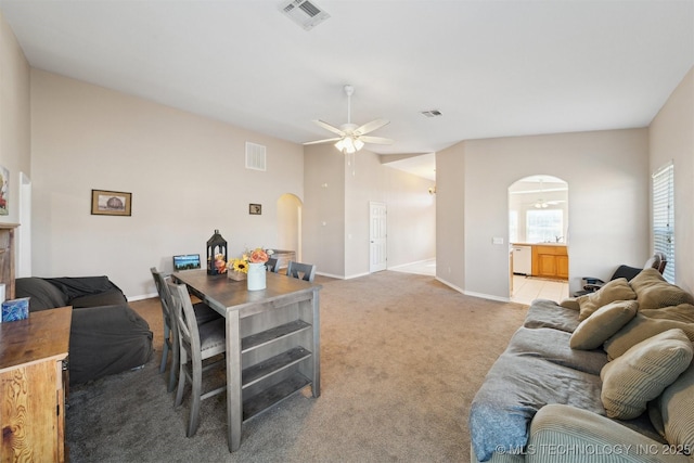 carpeted living room with sink and ceiling fan