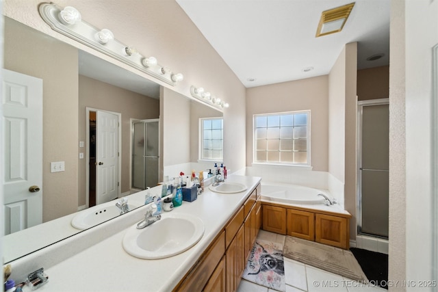 bathroom with tile patterned floors, separate shower and tub, and vanity