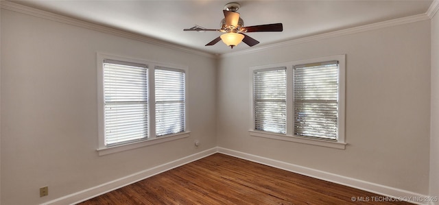 empty room with crown molding, dark hardwood / wood-style floors, a wealth of natural light, and ceiling fan