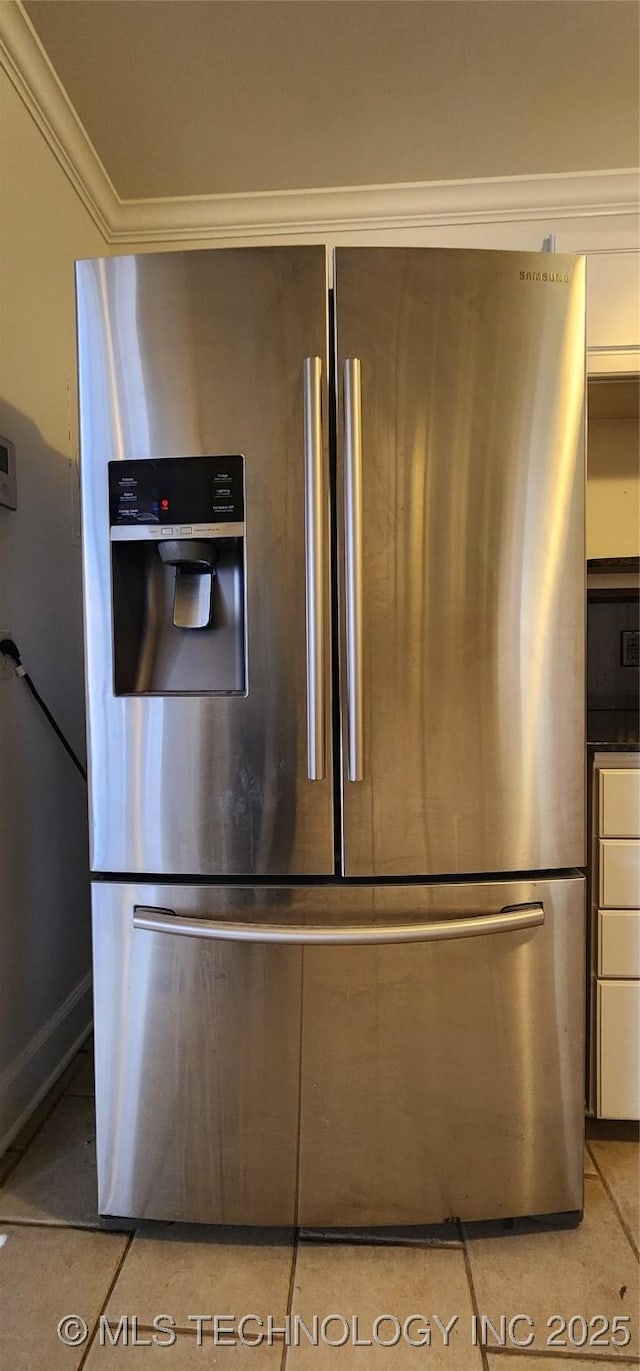 interior details with stainless steel refrigerator with ice dispenser and ornamental molding