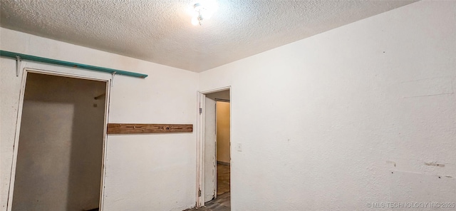 interior space featuring a textured ceiling