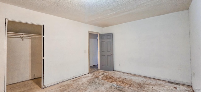 unfurnished bedroom with a closet and a textured ceiling