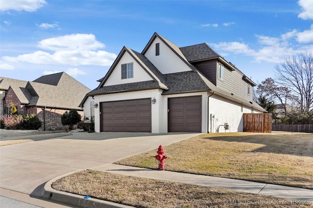 view of front of home featuring a garage and a front yard