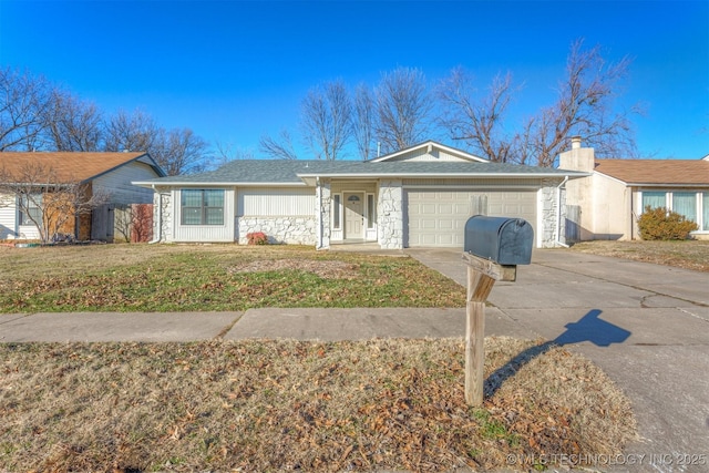 ranch-style home featuring a garage and a front yard