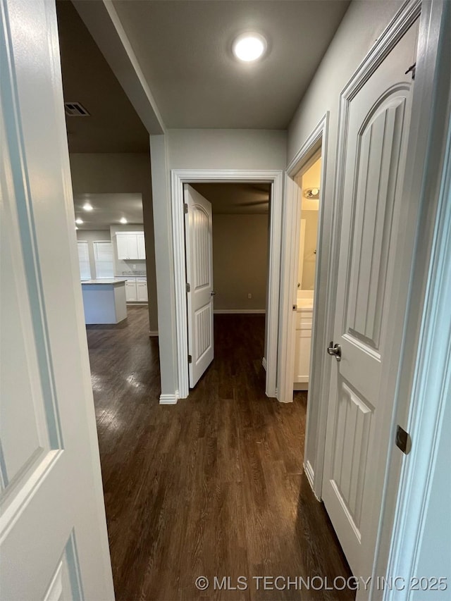 hallway featuring dark hardwood / wood-style floors