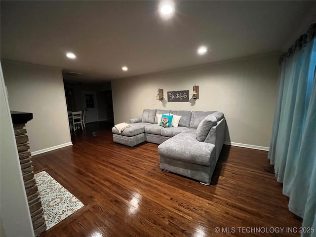 living room featuring dark hardwood / wood-style flooring