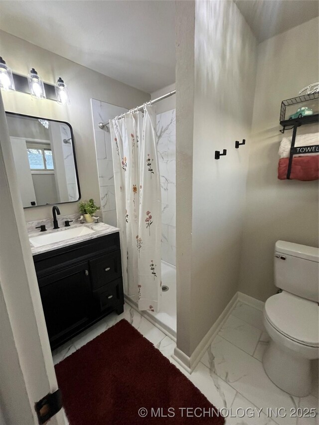 bathroom featuring vanity, toilet, and a shower with shower curtain