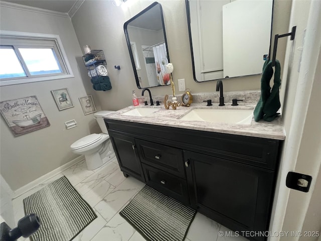 bathroom featuring vanity, ornamental molding, and toilet