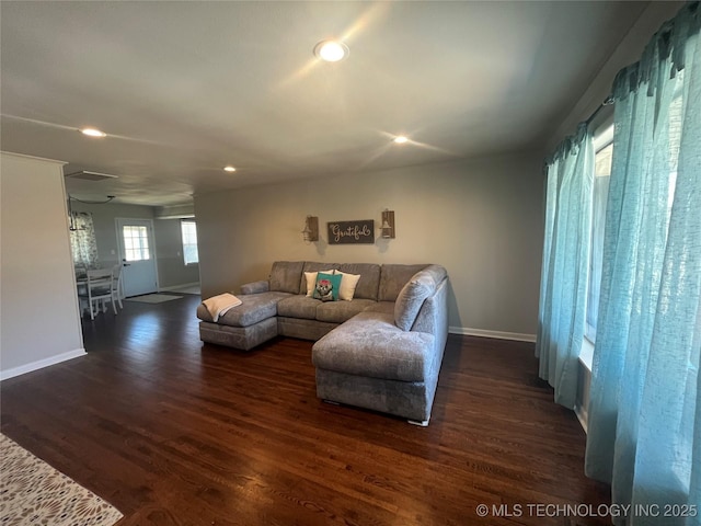 living room with dark hardwood / wood-style floors