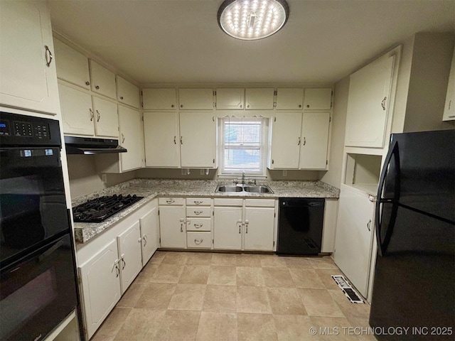 kitchen featuring white cabinetry, sink, and black appliances