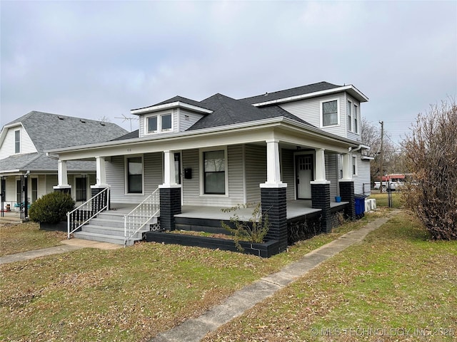 view of front of home featuring a front lawn and a porch