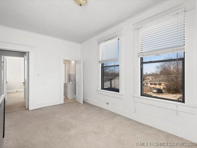 unfurnished bedroom featuring light colored carpet