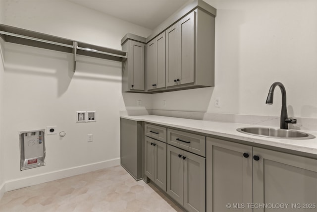 laundry area featuring sink, cabinets, washer hookup, light tile patterned floors, and electric dryer hookup