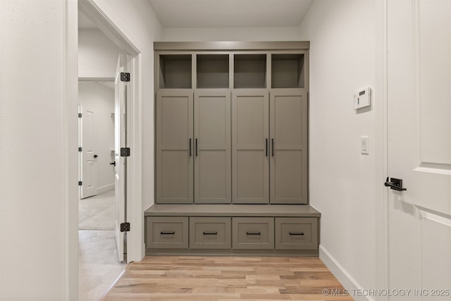 mudroom with light hardwood / wood-style flooring