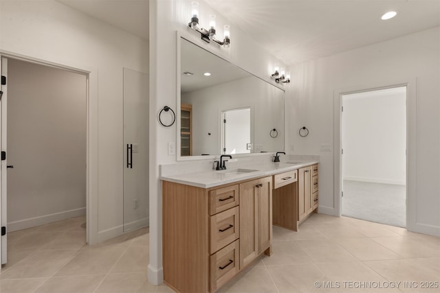 bathroom featuring tile patterned floors and vanity