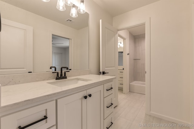 bathroom with vanity, tile patterned flooring, and shower / bathing tub combination