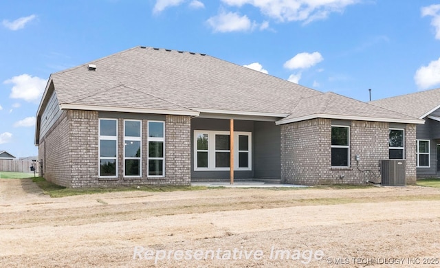 rear view of house featuring a patio and cooling unit