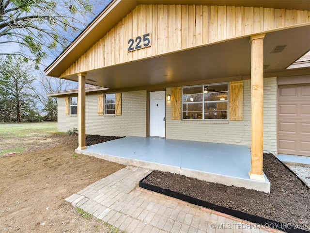 doorway to property featuring covered porch