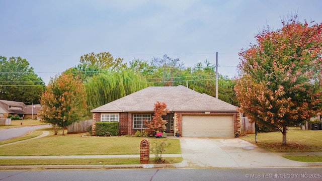 view of front of property featuring a garage and a front yard