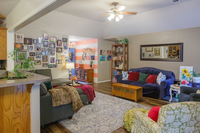 living room featuring dark hardwood / wood-style floors and ceiling fan