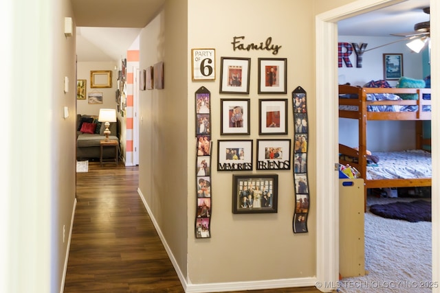 hallway with dark hardwood / wood-style flooring