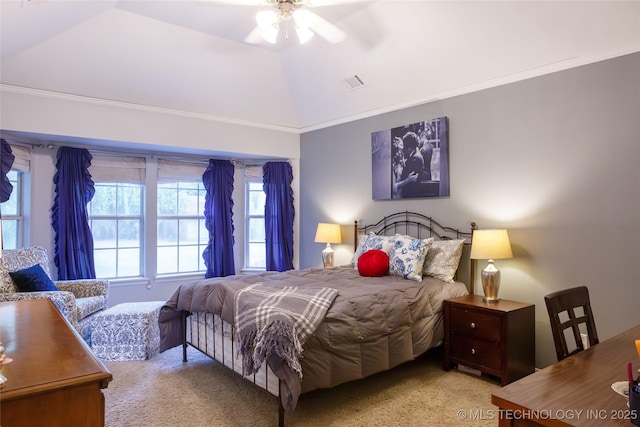 bedroom featuring ornamental molding, lofted ceiling, light colored carpet, and ceiling fan