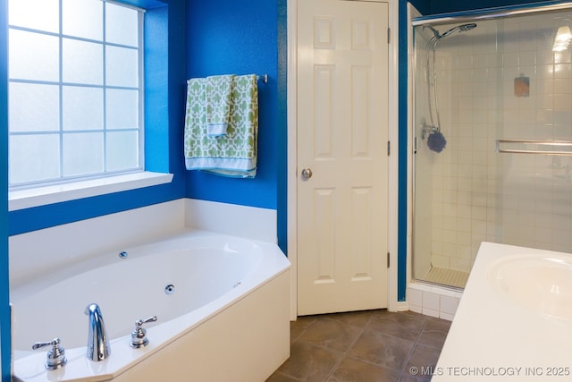 bathroom with tile patterned flooring, sink, and separate shower and tub