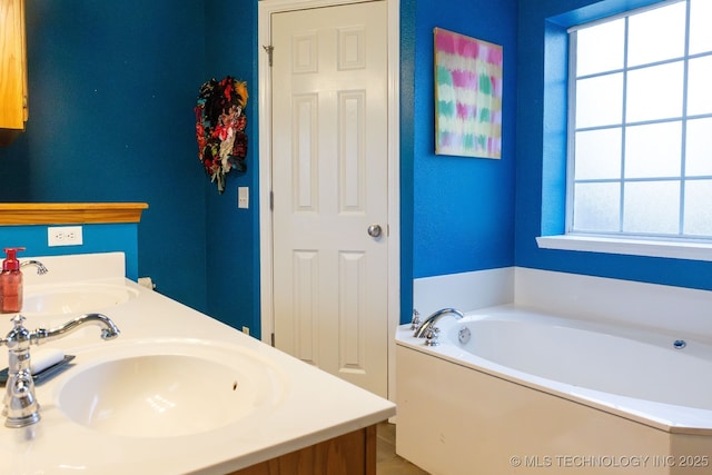 bathroom featuring vanity and a bathtub