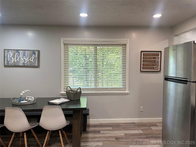 dining area featuring wood-type flooring