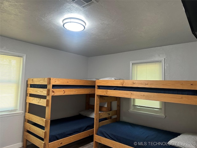 unfurnished bedroom with a textured ceiling