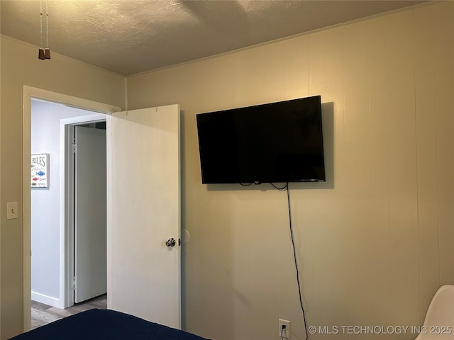 unfurnished bedroom with a textured ceiling