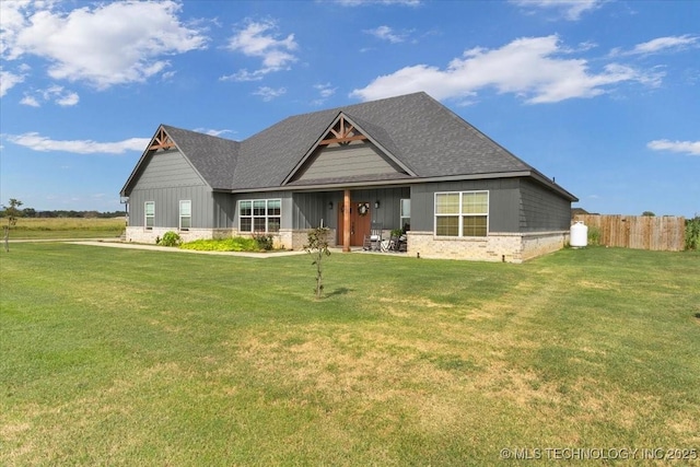 craftsman inspired home with a front lawn