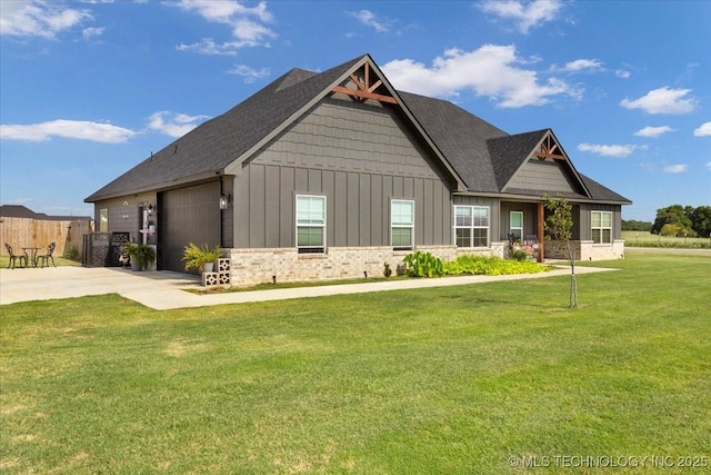 craftsman-style home with a garage and a front yard