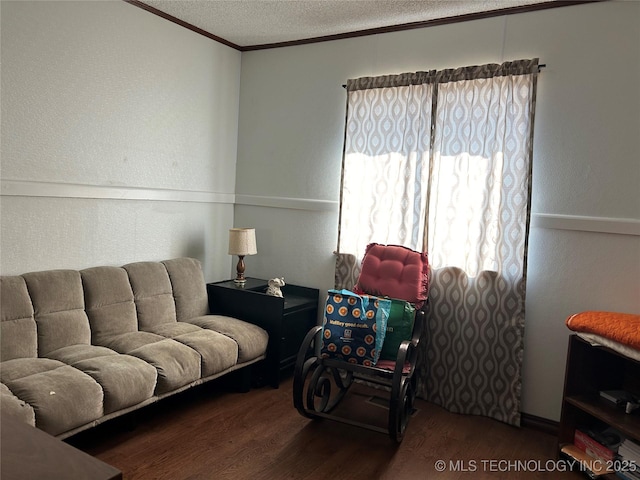 living room featuring hardwood / wood-style floors and a textured ceiling