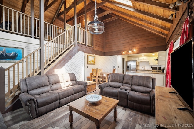 living room with dark wood-type flooring, wood ceiling, high vaulted ceiling, wooden walls, and beamed ceiling