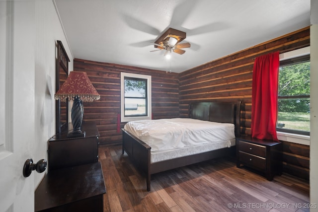 bedroom with dark wood-type flooring and ceiling fan