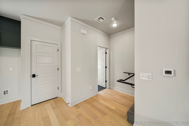 hallway with hardwood / wood-style floors