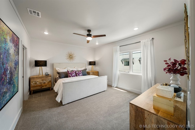 bedroom featuring crown molding, carpet flooring, and ceiling fan