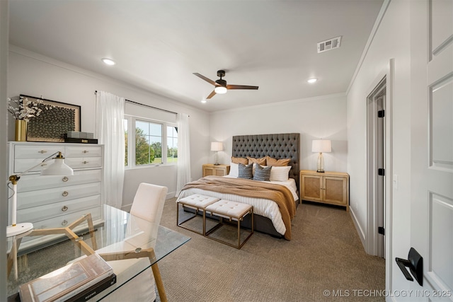 carpeted bedroom featuring crown molding and ceiling fan