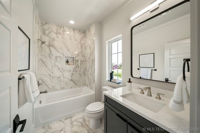 full bathroom with vanity, toilet, and tiled shower / bath combo