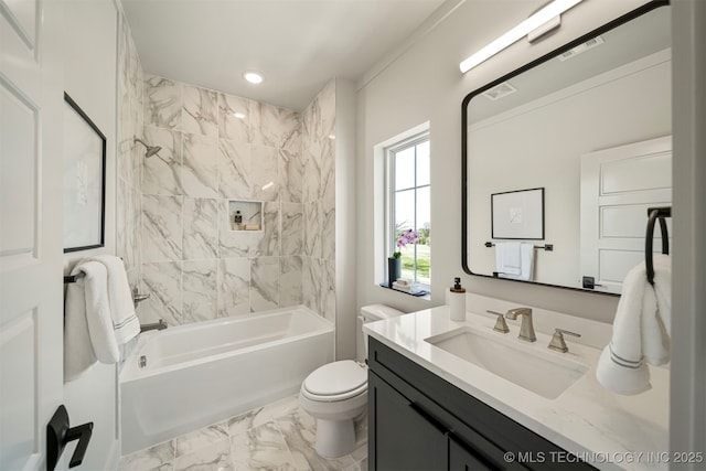 full bathroom with vanity, tiled shower / bath combo, and toilet