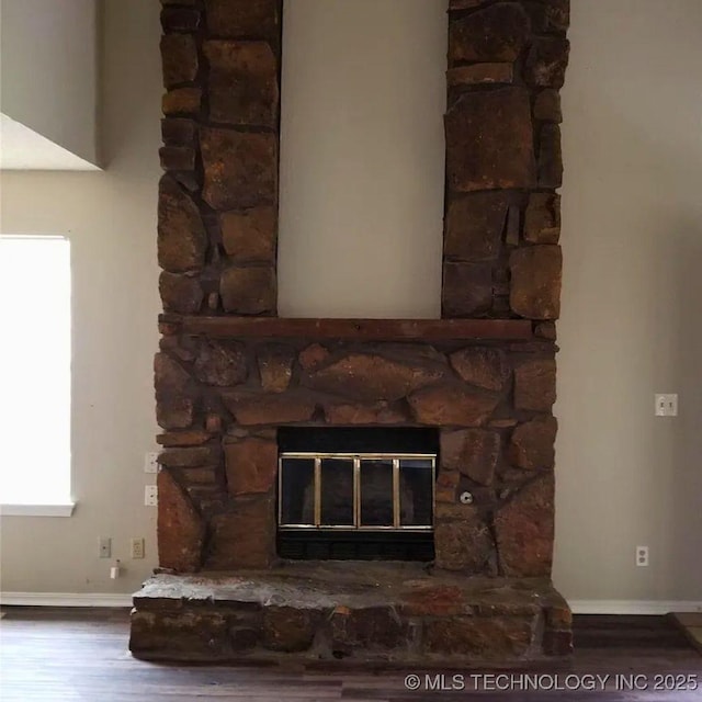 room details featuring hardwood / wood-style floors and a fireplace