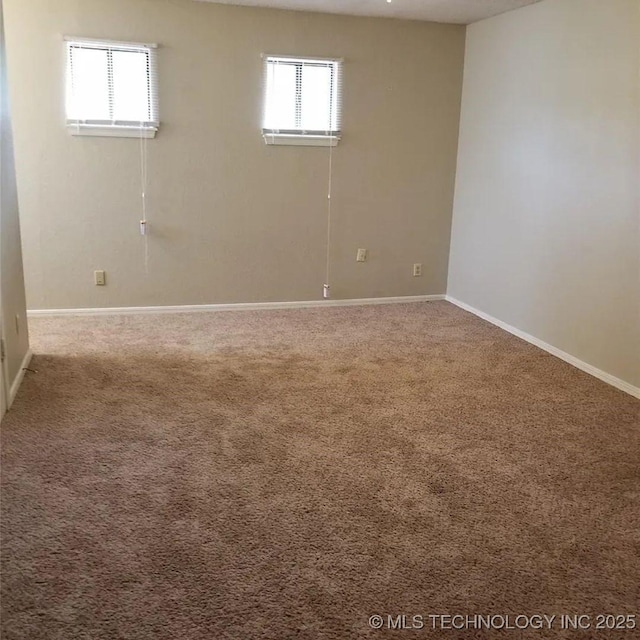 carpeted empty room with a healthy amount of sunlight