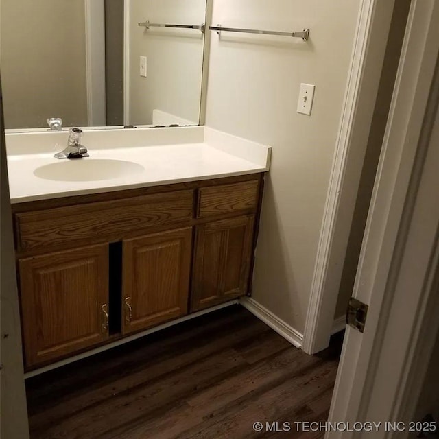 bathroom featuring vanity and wood-type flooring