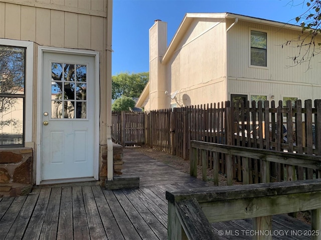 view of property exterior featuring a wooden deck