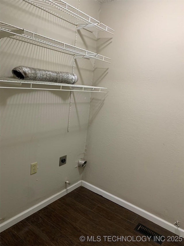 laundry area featuring hardwood / wood-style flooring, gas dryer hookup, and electric dryer hookup