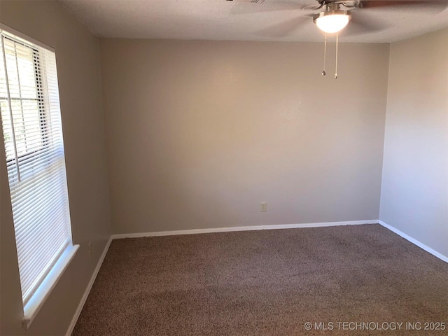 unfurnished room with ceiling fan, carpet flooring, and a textured ceiling