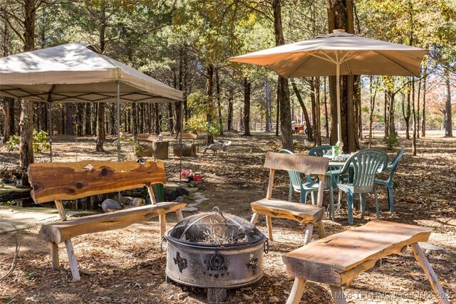 view of patio featuring an outdoor fire pit